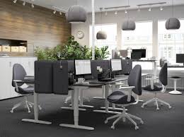A Black And Grey Office With The Height Adjustable Sit Stand Bekant Desk In Black Brown White Salle A Manger Design Chaise De Salon Table Salle A Manger