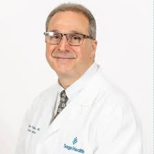 Dr. Austin C. Stokes, MD