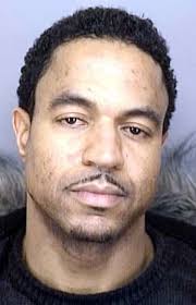 1 held, 2 sought in car fire killings