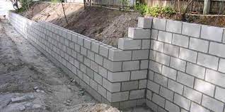 How Much Does It Cost To Build A Retaining Wall In 2019 Inch Calculator Building A Retaining Wall Retaining Wall Construction Concrete Block Retaining Wall