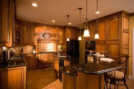 Tuscan Style Raised Panel Cherry Cabinetry Pendant Lights Over Raised Bar Granite Countertops Great Tuscan Kitchen Kitchen Island Lighting Kitchen Styling