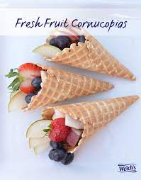 Fresh Fruit Cornucopias Using Waffle Cones And Assorted Fruit Fun Thanksgiving Treat Thanksgiving Snacks Healthy Thanksgiving Treats Easy Meals For Kids