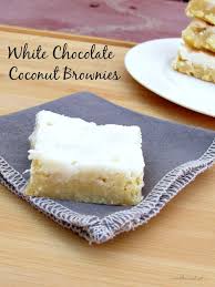 This outrageous cake is made with layers of brownie, coconut chocolate chip cheesecake, chocolate cake and coconut pecan filling and covered in chocolate frosting and chocolate chips! White Chocolate Coconut Brownies Num S The Word
