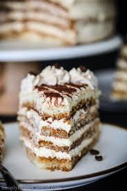Moist Sponge Cake Soaked In Coffee Liqueur And Layered Between A Rich Mascarpone Based Cream Tiramisu Cake Recipe Food Videos Desserts Lemon Coffee Cake Recipe