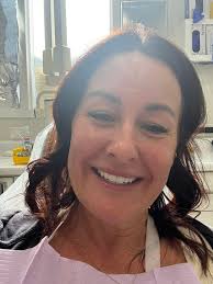 Showing off new smile after dental work