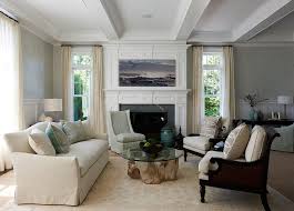 I own a very comfortable camel back sofa; Earth Tone Living Room With Cream Camelback Sofa And Green And Gray Pillows Transitional Living Room