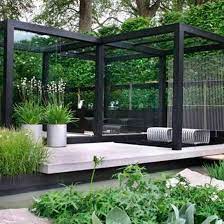 Garden arbor can make a difference to the entire landscape. Elegant Outdoor Dining Area Chelsea Flower Show Image Ideal Home Modern Garden Design Modern Garden Garden Design