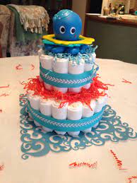 Edible decor makes me happy, and so these little lollipops in blue jars from kara's party ideas make me ecstatic. Diaper Cake Centerpiece For Underwater Baby Shower Theme Sea Baby Shower Theme Octopus Baby Shower Boy Baby Shower Themes