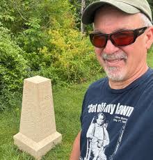 GREETINGS FROM THE FIRST-SHOT MARKER, GETTYSBURG — 2015, 2024 and 2025.  I've barely aged! 😬