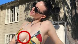 Billie Eilish reveals chest tattoo in rare bikini photo | news.com.au —  Australia's leading news site