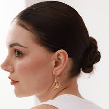 Women wearing hoop earrings