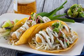 Assemble tacos to your liking with 3 or 4 pieces of fish, cabbage, salsa, sour cream, avocado, cilantro, and hot sauce. Beer Battered Fish Tacos Cacique Inc
