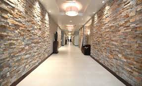 Gold Stacked Stacked Stone Walls In Hallway Of Hotel Stone Walls Interior Stone Wall Interior Design Interior Wall Design