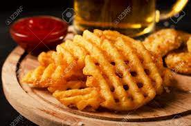 Bird's eye potato waffles, they're waffly versatile. Crispy Potato Waffles Fries Wavy Crinkle Cut Criss Cross Cries Stock Photo Picture And Royalty Free Image Image 117849098
