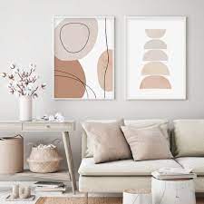 The stone wall of the living room helps provide texture to the space while bringing in the colors of the desert. Abstract Geometric Brush Beige Boho Style Canvas Painting Wall Art Pictures Posters Prints Interior Living Room Home Decor Wall Art Accents
