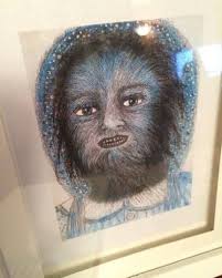 What does the wolf girl etching symbolize in the context?