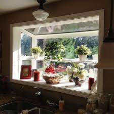 A small greenhouse window in a kitchen can provide fresh herbs and spices for cooking and may even provide room for small vegetables to grow. Amazing Ideas About Greenhouse Windows Kitchen Dhlviews Kitchen Garden Window Kitchen Bay Window Garden Windows