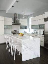 Visit us at www.eastcoastgranitecolumbia.com to see more of our work. Marble Waterfall Island Glass Pendants In Modern White Kitchen Mid Century Modern Kitchen Design Modern Kitchen Design Kitchen Island Design