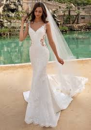 A wedding gown with a train is sure to make you stand out and plus you'll get amazing photos. Pronovias Morocco Tattoo Effect Back Lace Wedding Dress Designer Bridal Room