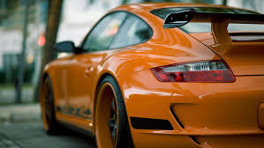 This 911 997 gt3 rs would probably corner faster than a carrera gt because the 911 997 gt3 rs wieghs only wieghs 3025lbs and is designed for fast cornering on test tracks with sharp corners.although the 911 997 gt3 rs would not be any where near as fast as a carrera gt on striaghts because the 911 997. Hd Wallpaper Porsche 997 Gt3 Rs Hd Orange Porsche 911 Wallpaper Flare