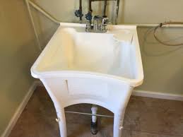how to install a new laundry tub and