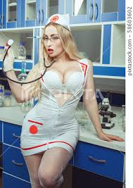 Sexy nurse with big breasts stands in the - Stock Photo [58603602] - PIXTA