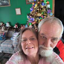 Who are the babies in the photo with Roy and Geneva Farley?