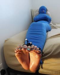 Tight mummification. Soft vulnerable soles exposed. Clip available