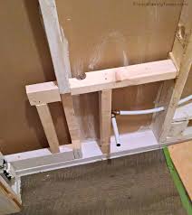 This toilet's plumbing runs up through the ceiling and connects to the main sewage line. How To Diy Bathroom In Basement Without Breaking Concrete