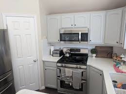 Kitchen Refinished In Sherwin Williams Light French Gray By Chameleon Painting Slc Ut Kitchen Refinishing Refinishing Cabinets Laundry Room Cabinets