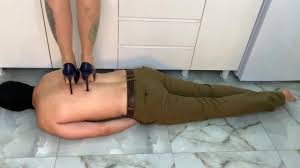 Trampling. Lie still and feel the weight and power of Dominatrix Nika