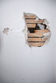 How To Fix Small Holes In Drywall With Images Break Wall Repairing Plaster Walls Plaster Walls