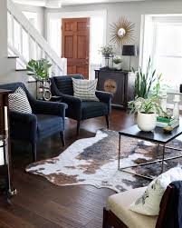 Living Room With Navy Chairs Faux Cowhide Rug Rugs In Living Room Cow Rug Living Room Living Room Carpet
