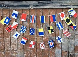 I am going to use the flags to spell our last name! Nautical Flags Garland A Z Small Flags Etsy Nautical Flags Flag Garland Small Flags