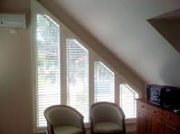 Battery operated arched and angled blinds operated with a remote control are the standard motorized blinds option. Angled Shutters An Ideal Solution For Any Shape Of Window Plantationshutters Com Au