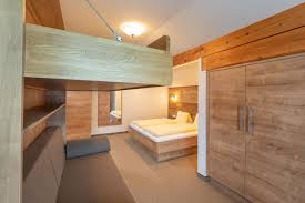 The apartment includes 2 bedrooms and a kitchen with a dishwasher and a stovetop. Ferienwohnungen Wagrain Haus Katja Salzburger Land