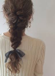 We hope the above options gave you an idea of how many different ways to style your amazing twists. Sweet Messy Braid Style With A Bow Women Hairstyle Haircuts
