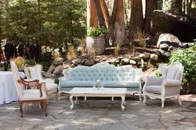 A Vintage Lounge Area At Calamigos Ranch Our Seaglass Sofa Keegan Chair Josette Chair Wesley Vintage Rentals Lounge Seating Area Table Flower Arrangements