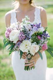 Flowers come in an amazing range of colors, both natural and tinted, so it won ' t be difficult to find blooms that perfectly match the rest of your wedding. Green And Purple Wedding Bouquets Novocom Top