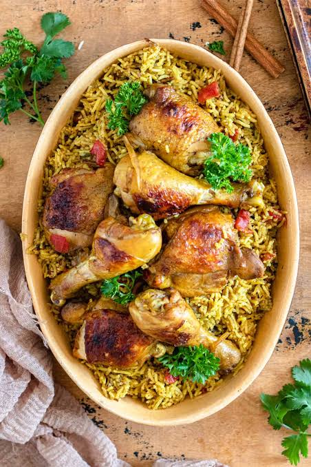 Bahraini Machboos variation with lamb, dried fruits, and nuts served on a traditional platter