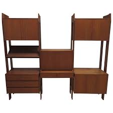 This large three bay wall unit features a versatile mixture of cabinet and shelf storage. Wonderful Danish Modern Three Bay Teak Wall Unit Mid Century Two Sided At 1stdibs