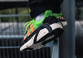 Black And Neon Orange Adidas Shoes The Adidas Lxcon X Model Pack Features Neon Gradient Uppers With Orange Stripes Sneakers Nike Adidas Jordans Sneakers