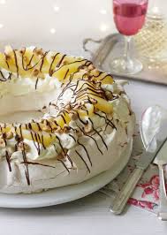 An absolute must for christmas day. Pear Hazelnut And Chocolate Pavlova Recipe Recipe Pavlova Recipe Berries Recipes Mary Berry Recipe