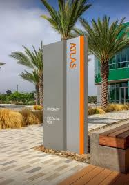 The Illuminated Pan Channel Building Top Sign The Building Top Logo Is Mounted To Knife Plates Integrated Into Environmental Graphic Design Signage Wayfinding