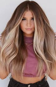 You can go for a light brown color with highlights and smooth waves, or blonde hair with red lips will make you look superb for a special occasion. Best Hair Colours To Look Younger Fading Blonde And Face Frame