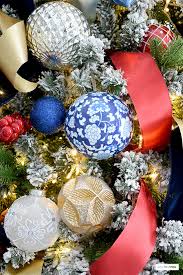 Christmas trees, wreaths, garlands, ornaments, tableware, lights, stockings, and other holiday accents can transform any space into a festive wonderland. Sophisticated Blue And Red Christmas Tree Citrineliving