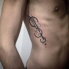 The level of detail and thin long tree barks gives this piece a serene and pale look which is in trend these days. 25 Rib Tattoos For Men Who Laugh At Pain