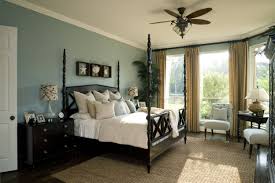 A Gorgeous Bedroom With Light Blue Walls White Crown Molding And Dark Hardwood Floors Click To See Our Master B Master Bedroom Makeover Bedroom Makeover Home