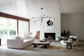 Painted brick wall and wooden floor with glowing light bulbs. These Rooms Might Convince You To Paint Your Brick Walls