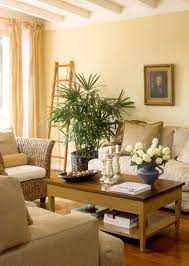 Why not add a cheerful touch through a. Pale Yellow Paint Modern Living Room Design Yellow Walls Living Room Yellow Living Room Living Room Wall Color